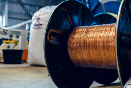 Production of copper wire, cable in reels at factory. Cable factory. Close up.