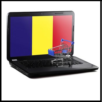 laptop z flaga rumuni na ekranie i wozkiem zakupowym