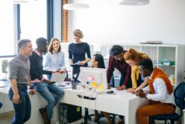 An international team of employees in an office as an illustration of foreigners on the Polish labor market