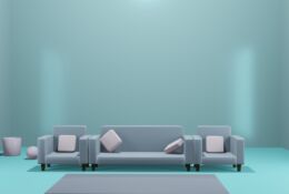 a solitary modern sofa in a large room