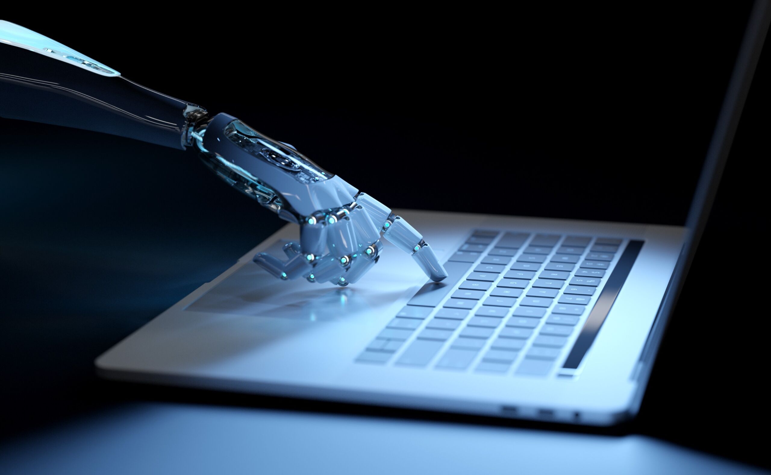 yborg hand pressing a keyboard on a laptop in dark blue background