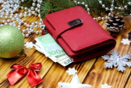 Red wallet with euro on the Christmas background