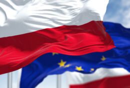 flying two Polish flags in the wind and in the middle of the EU