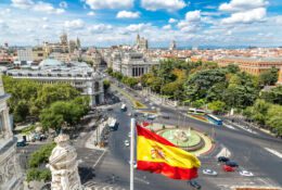 Mountain view of Madrid and the flag of Spain